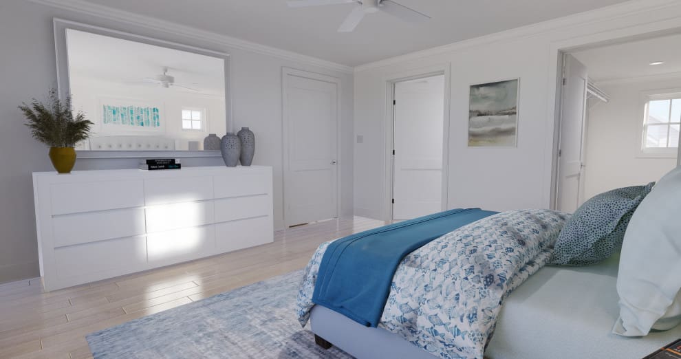 A bedroom with white walls and blue bedding.