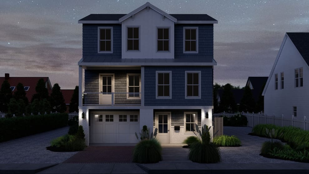 A house with a garage and a porch at night.