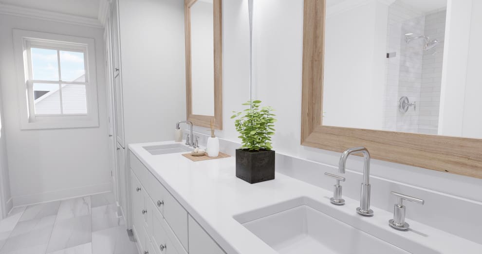 A bathroom with two sinks and mirrors