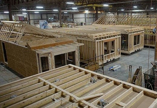 A warehouse with many wooden structures in it.